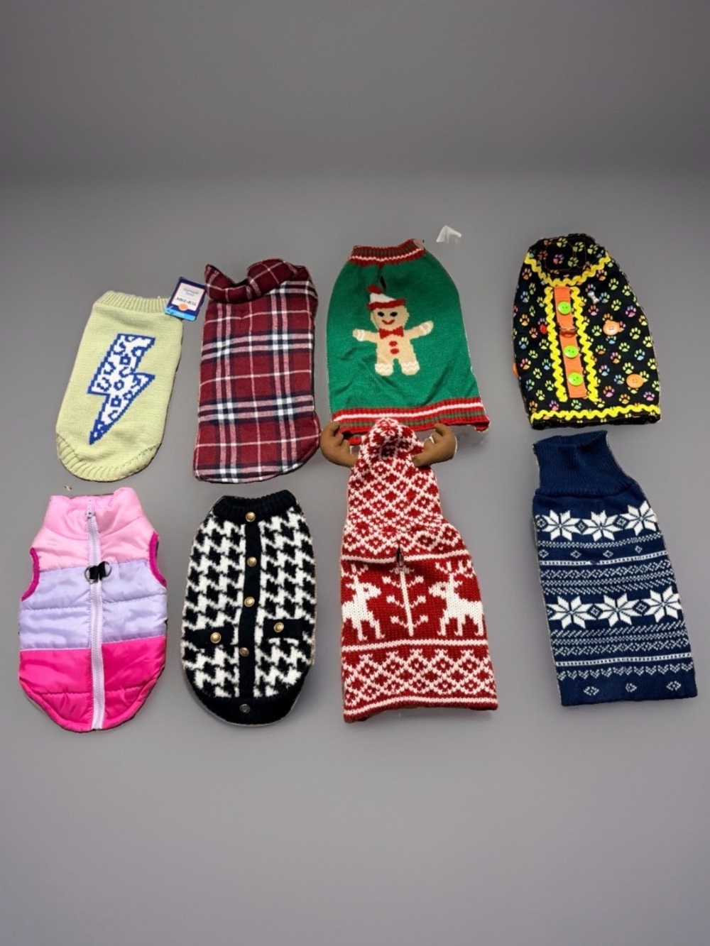 Various assortment of dog clothes. Fits small size dog. Set of 8. Good condition